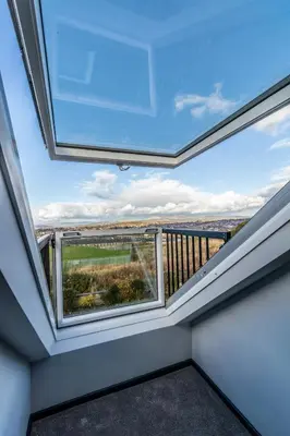 a skylight in a room with a balcony at Loft apartment in Accrington Stunning Lancashire views in Church