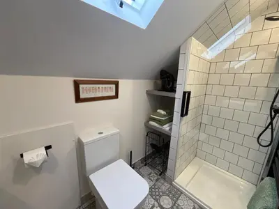 a bathroom with a toilet and a shower at Loft apartment in Accrington Stunning Lancashire views in Church