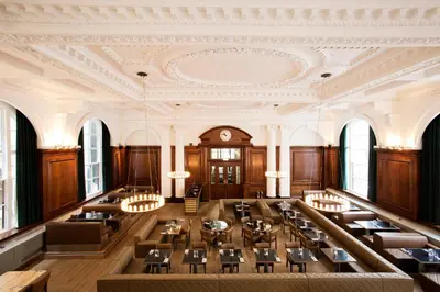 a large dining room with tables and chairs at Aloft Liverpool in Liverpool