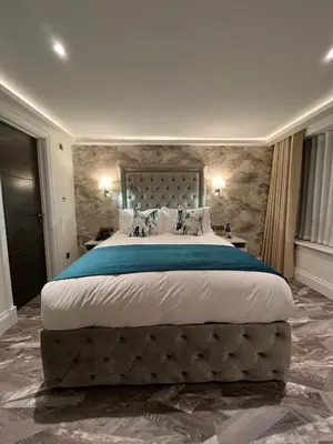 a large bedroom with a large bed in a room at Philharmonic Hotel in Liverpool