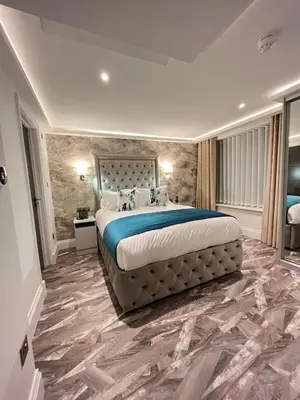 a large bedroom with a large bed in it at Philharmonic Hotel in Liverpool