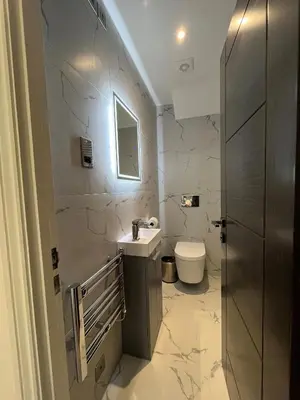 a bathroom with a sink and a toilet at Philharmonic Hotel in Liverpool