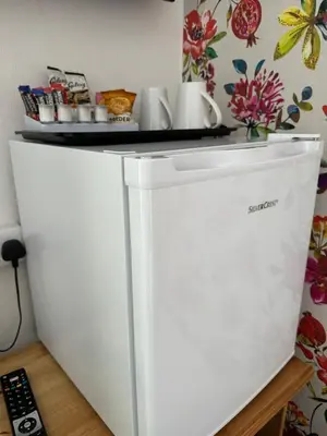 a white refrigerator with a counter on top of it at The Scala Hotel in Blackpool
