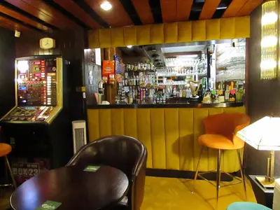 a restaurant with a bar with a table and chairs at The Scala Hotel in Blackpool