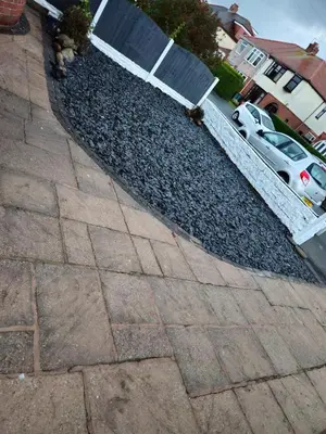a pile of rocks and a car parked in a driveway at Number 1 Preston Stays in Preston
