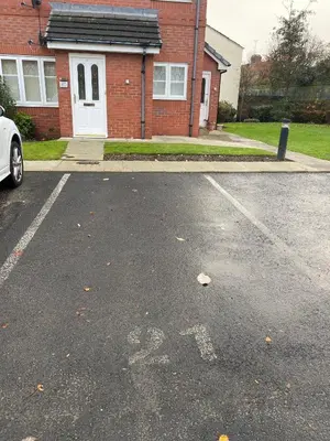 a parking lot in front of a house at Lovely 2 bed apartment in Crosby in Liverpool