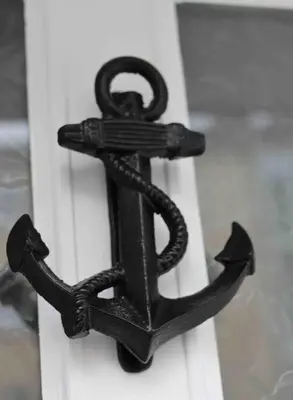 a black anchor attached to a white door at Riverside House Lancaster - 2 bedroom house in Lancaster