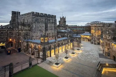 a large building with a clock tower on it at Riverside House Lancaster - 2 bedroom house in Lancaster
