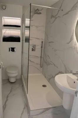 a bathroom with a shower and a toilet and a sink at Riverside House Lancaster - 2 bedroom house in Lancaster