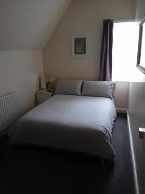 a bed in a small room with a window at Number twenty five in Blackpool