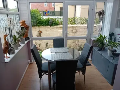 a dining room with a glass table and chairs at Number twenty five in Blackpool
