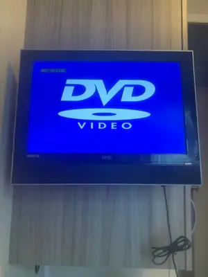 a tv with a blue screen on a wall at Haven Lakeland 3 Bed Luxury Caravan in Flookburgh