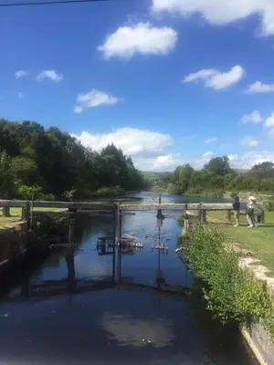 a view of a river with a bridge over it at Haven Lakeland 3 Bed Luxury Caravan in Flookburgh