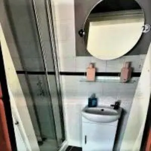 a bathroom with a sink and a mirror at Mr smiths/ The old Stanley arms in Liverpool