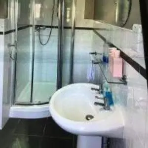 a bathroom with a sink and a shower at Mr smiths/ The old Stanley arms in Liverpool