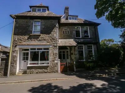an old stone house on a street at Sunnycote in Carnforth