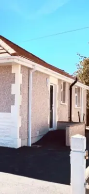 a brick house with a driveway in front of it at Eden Stay in Morecambe