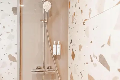 a bathroom with a shower with a shower head at Village Hotel Blackpool in Blackpool