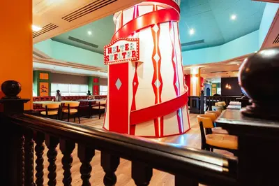 a restaurant with a red and white column in the middle at Village Hotel Blackpool in Blackpool