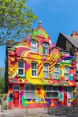a colorful house with a painting on the side of it at LFC Football Apartment Anfield in Liverpool