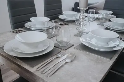 a table with white plates and silverware on it at HORNSEY LODGE - Strictly NO Parties in Liverpool