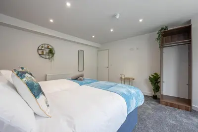 a bedroom with a large white bed in a room at Morecambe Bay Free Parking Beach Front in Morecambe