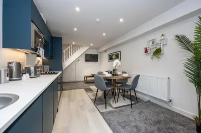 a kitchen and dining room with a table and chairs at Morecambe Bay Free Parking Beach Front in Morecambe