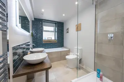 a bathroom with a sink and a toilet and a shower at Morecambe Bay Free Parking Beach Front in Morecambe