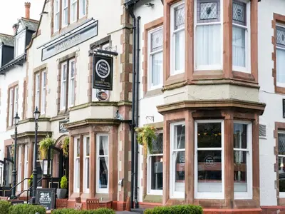 a building with a sign on the side of it at The County Hotel by Innkeeper's Collection in Lytham St Annes