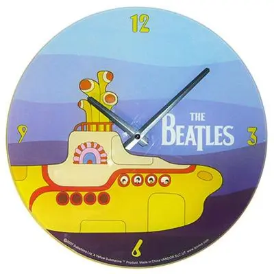 a clock with a picture of a yellow bus at Beatles Apartment in Liverpool