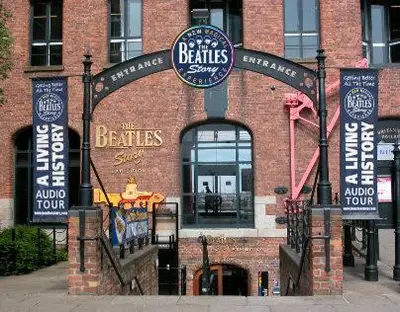 a brick building with an entrance to a restaurant at Beatles Apartment in Liverpool