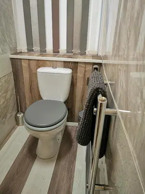 a bathroom with a white toilet in a room at Somerset House Apartments in Blackpool