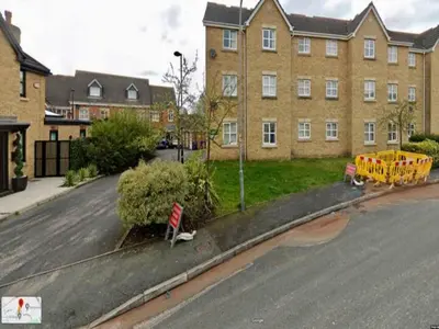 a street in front of a large brick building at The Point , 2 Bed, Parking - Pass the Keys in Knowsley