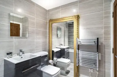 a bathroom with a sink toilet and a mirror at Central Liverpool 1 Bed Apartment w Balcony in Liverpool