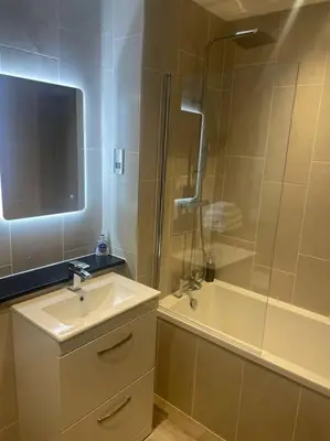 a bathroom with a sink and a shower and a tub at 1 Bed Apt - Balcony - City View - Great Location in Liverpool