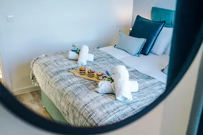 a bedroom with a bed with a tray of food on it at NEW! Stunning 2-bed apartment in Liverpool by 53 Degrees Property - Amazing location, Ideal for Small Groups - Sleeps 4! in Liverpool