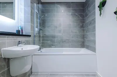 a bathroom with a sink and a tub and a toilet at NEW! Stunning 2-bed apartment in Liverpool by 53 Degrees Property - Amazing location, Ideal for Small Groups - Sleeps 4! in Liverpool