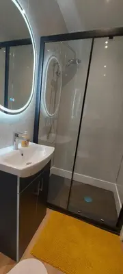 a bathroom with a shower and a sink at OLIVE TREE - 2 Master bedroom (sleeps 6) in Blackpool