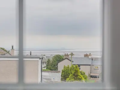 a view of the ocean from a window at 3 Bed in Baycliff SZ130 in Baycliff