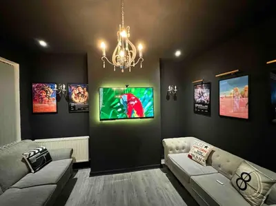 a living room with a couch and a chandelier at Now Screening…Large Movie Place 60 Inch TV (Sleep 11) in Liverpool