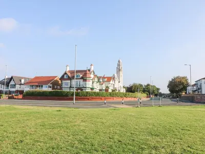 a park with houses and a field of grass at 6D Clifton Drive in Lytham St Annes