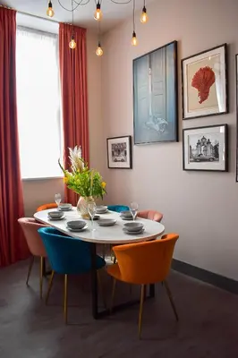 a dining room with a table and chairs at Duke Street Townhouse by EPIC in Liverpool