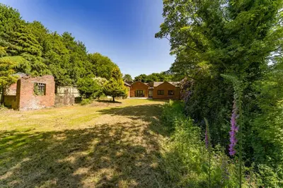 an empty yard with a house in the background at Modern 5BR Victorian Home in Liverpool in Knowsley