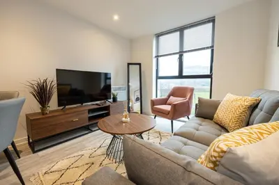 a living room with a couch and a tv at GuestReady - Amazing stay in Liverpool in Liverpool