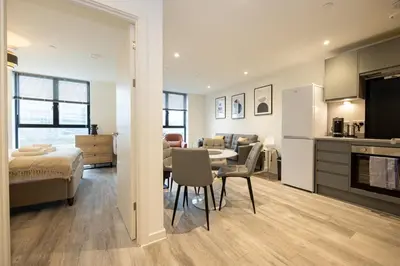 a living room with a kitchen and a dining room at GuestReady - Amazing stay in Liverpool in Liverpool