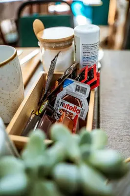 a box of utensils and other items on a table at Hesketh Hotel in Blackpool