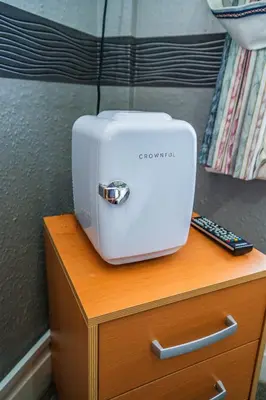 a white toaster sitting on top of a wooden table at Hesketh Hotel in Blackpool