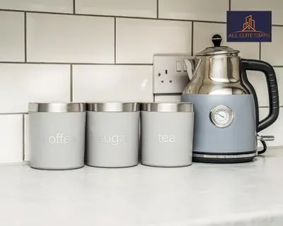 a group of four cups sitting on a kitchen counter at Swan House Apartment 9 - 2 Bed Apartment - Sleeps 6 - Free Parking - Liverpool - close to city centre - By ALL ELITE STAYS in Liverpool