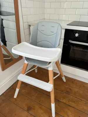 a high chair in a kitchen next to a stove at Blackpool Townhouse in Blackpool