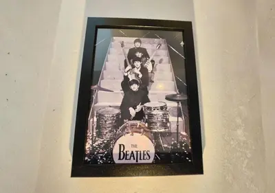 a picture of the beatles on the stairs at Matchday Mile House Walk to Anfield sleeps 8 in Liverpool